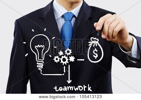 Close up of businessman drawing money making formula