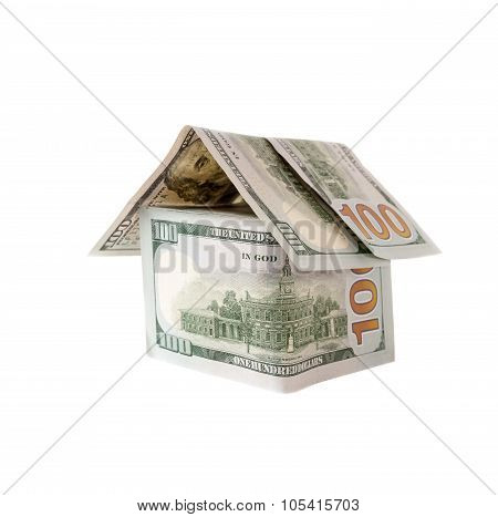 House made of hundred dollar bills isolated on white.