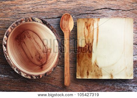 Empty Wooden Utensils On A Wooden Table Old Wooden Bowl, Wooden Spoon, Plate For Bread,top View.