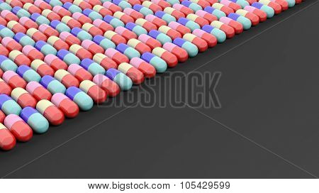 Colorful caplets with copy-space, isolated on black background.
