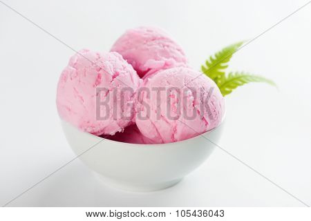 Scoop pink ice cream in bowl on white background.