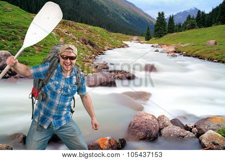 Tourist man on mountain river background
