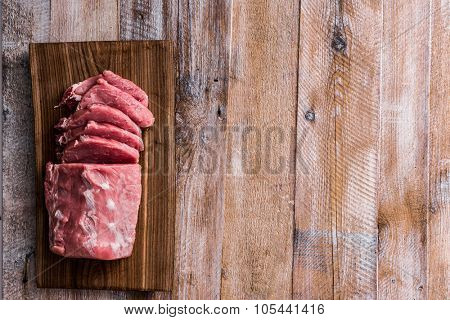 big piece of raw meat on table