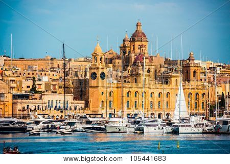 beautiful view on Birgu and the harbour with colorful boats in Malta