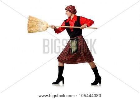 Funny woman in scottish clothing with broom