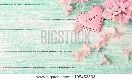 Decorative Heart  And  Hyacinths Flowers  On Turquiose Painted Wooden Planks.