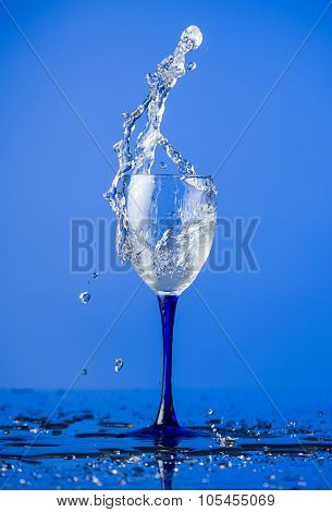 a glass of spilt liquid