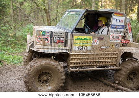 RUSSIA, PUSHKINO - 20 SEP, 2014: Sportsman is driving off-road vehicle at Rainforest Challenge Russia Autumn 2014 PRO-X.