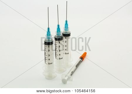 Three 5ml disposable syringes and one 1ml plastic syringe