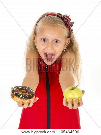 Little Beautiful Blond Child Choosing Dessert Holding Unhealthy Chocolate Donut And Apple Fruit