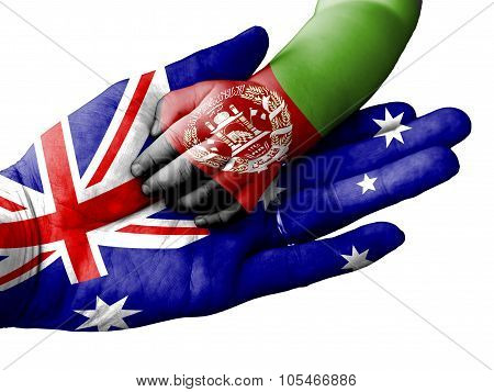 Adult Man Holding A Baby Hand With Australia And Afghanistan Flags Overlaid. Isolated On White