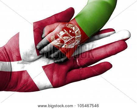 Adult Man Holding A Baby Hand With Denmark And Afghanistan Flags Overlaid. Isolated On White