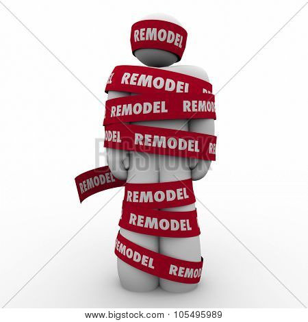 Remodel word on red tape wrapped around a home or property owner during a renovation or building improvement project