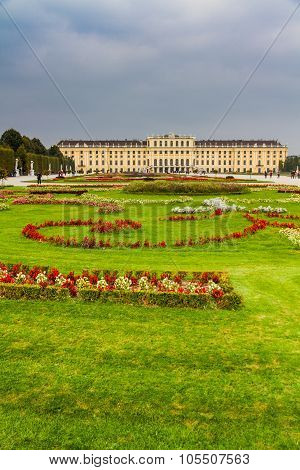 Schonbrunn royal castle and park with flowers and green grass - Schonbrunn Vienna Austria