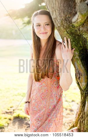Young girl in flowing dress in hazey glowy sun