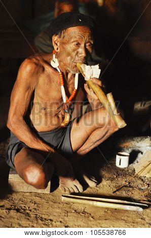 Elder Man Smoking Pipe In Nagaland, India