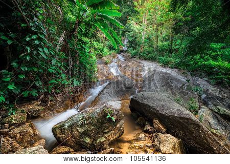 Tropical Rain Forest Landscape With Small Waterfall. Thailand