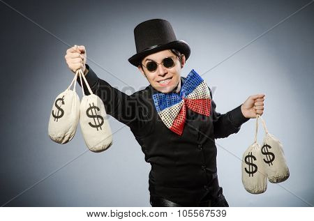 Funny man with money dollar sacks