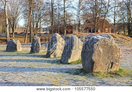 The Big Stones Standing In The Snow Field In Winter