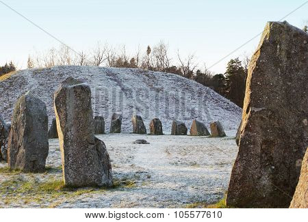 The Big Stones Standing In The Snow Field In Winter