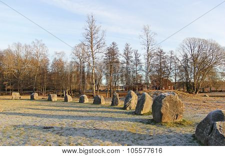The Big Stones Standing In The Snow Field In Winter