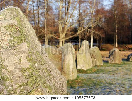 The Big Stones Standing In The Snow Field In Winter