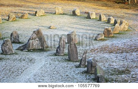 The Big Stones Standing In The Snow Field In Winter