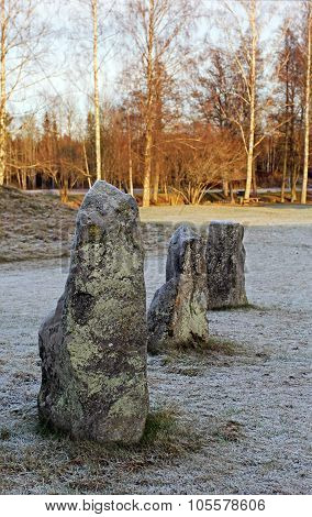 The Big Stones Standing In The Snow Field In Winter