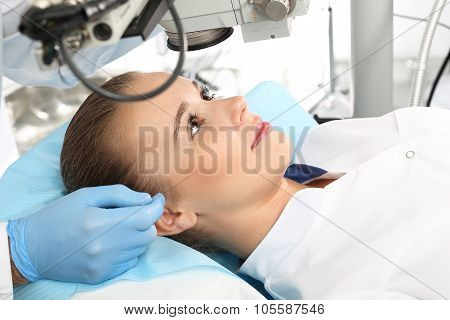 A patient in the operating room during ophthalmic surgery