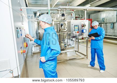 pharmaceutical factory service engineers in water preparation room operating equipment at pharmacy industry manufacture factory 