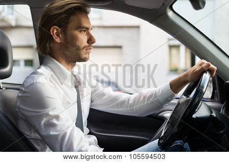 Portrait of a man driving his car