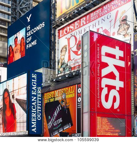 NEW YORK,USA - AUGUST 14,2015 : Billboards on Times Square next to the TKTS booth selling discount tickets to Broadway shows