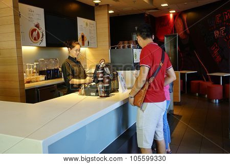 SHENZHEN, CHINA - OCTOBER 09, 2015: McCafe interior. McCafe is a coffee house style food and drink chain, owned by McDonald's.