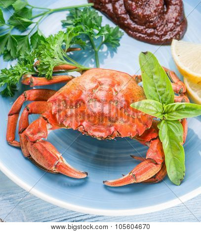 Seafood dish - cooked crab with lemon and herbs.