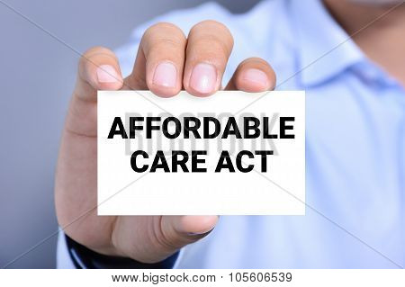 Affordable Care Act (or Aca) Message On The Card Shown By A Man