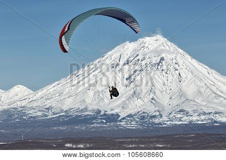 Paraglider Flying On Background Of Active Volcano