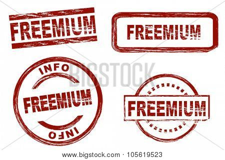Set of stylized red ink stamps showing the term freemium. All on white background.