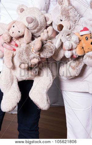 Female Helpers Offer Toys To Refugee Children