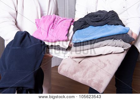 Female Helpers Offer Warm Clothes To Refugees