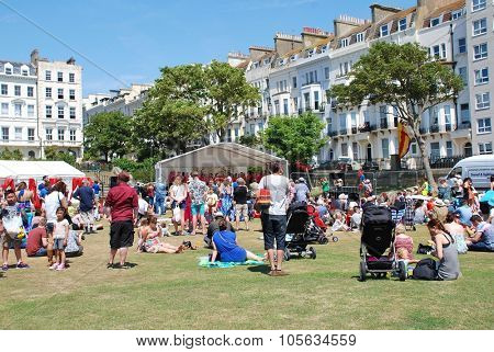 ST. LEONARDS-ON-SEA, ENGLAND - JULY 11, 2015: People enjoy the annual St.Leonards Festival held in Warrior Square Gardens. The free community music and entertainment event was first held in 2006.