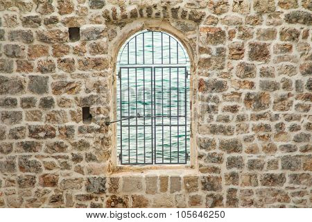 Old defensive stone wall and window in the Old town Dubrovnik, Croatia