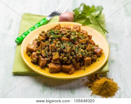 seitan stew with peas and curry, vegetarian food, selective focus