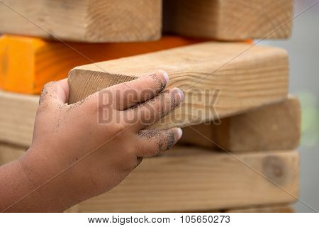 Child playing with the wood game in the beach