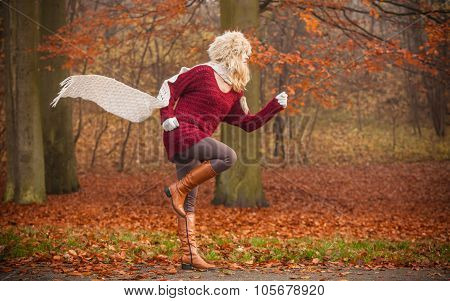Fashion Woman Running In Fall Autumn Park Forest.
