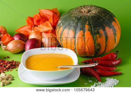 Pumpkin Soup With Onion And Pepper On Green Shadowless Backgroud