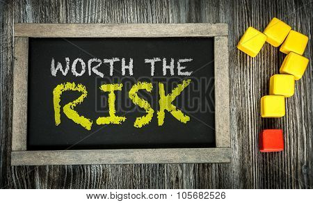 Worth the Risk? written on chalkboard