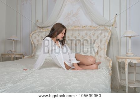 Portrait Of A Cute Girl On The Bed