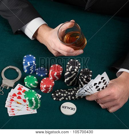 Gambler With Alcohol And Handcuffs