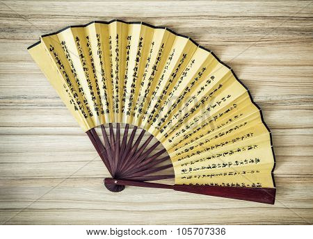 Traditional Eastern Fan On The Wooden Background