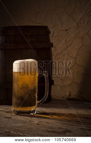 Still Life with a keg of beer and draft beer by the glass.